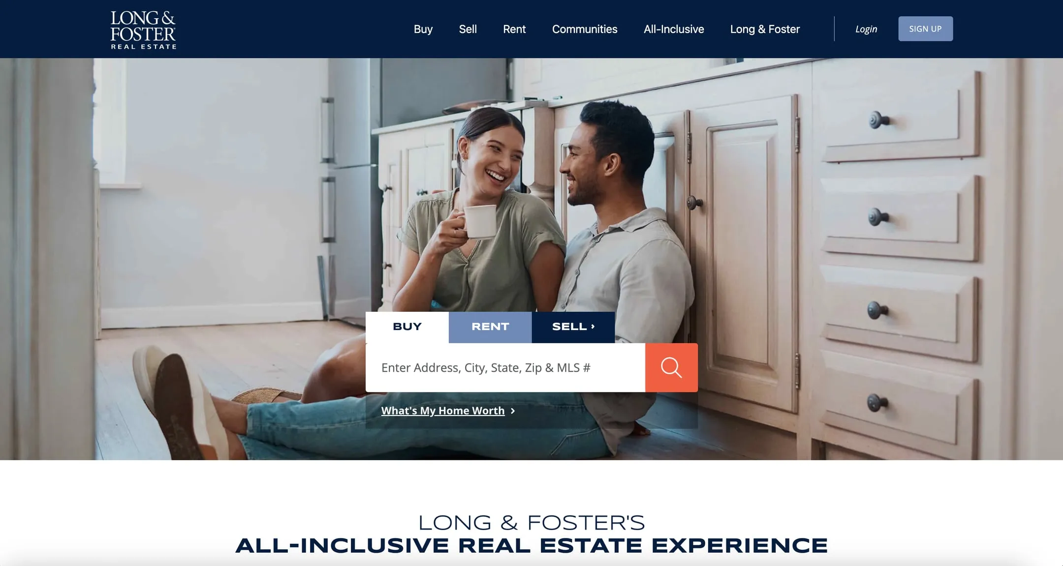 Long & Foster home page with a couple sitting on a kitchen floor and a buy, rent and sell search box